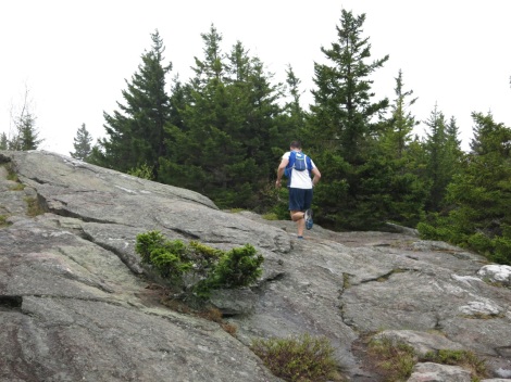a runner approaching one of the race's summits.